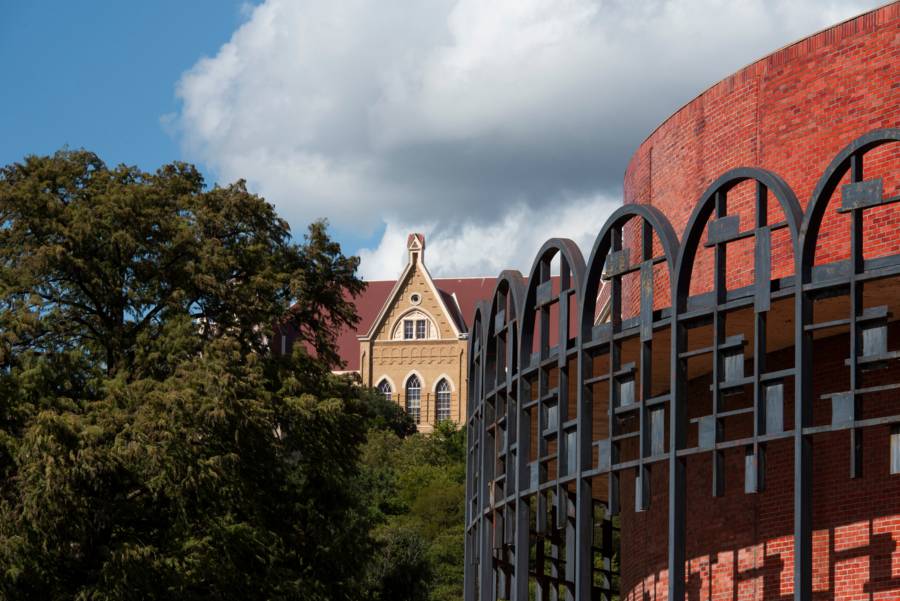 Old Main and the theatre building at Texas State University, a Watermark customer